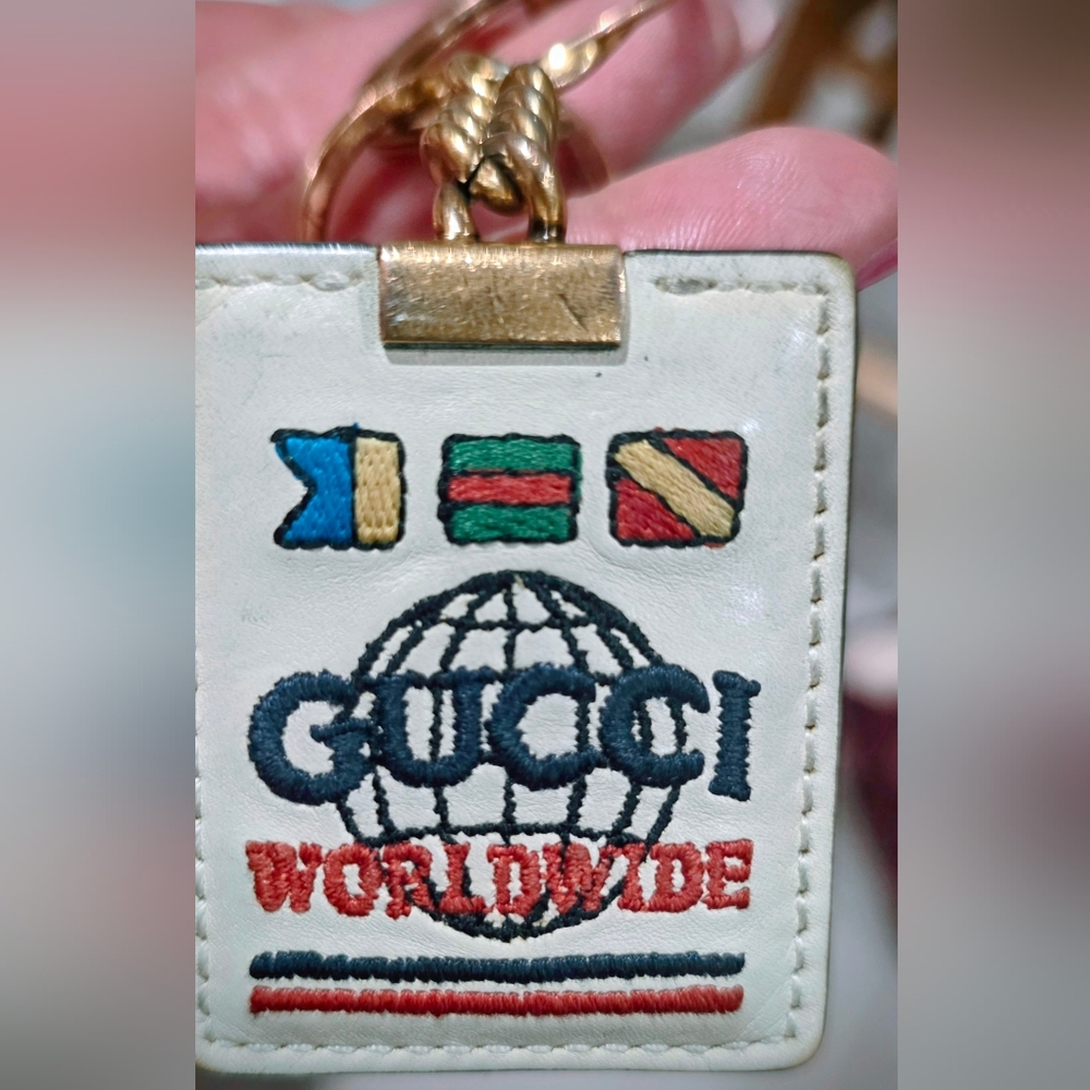Gucci White Leather Worldwide Embroidered Keychain with Gold Hardware. 2020